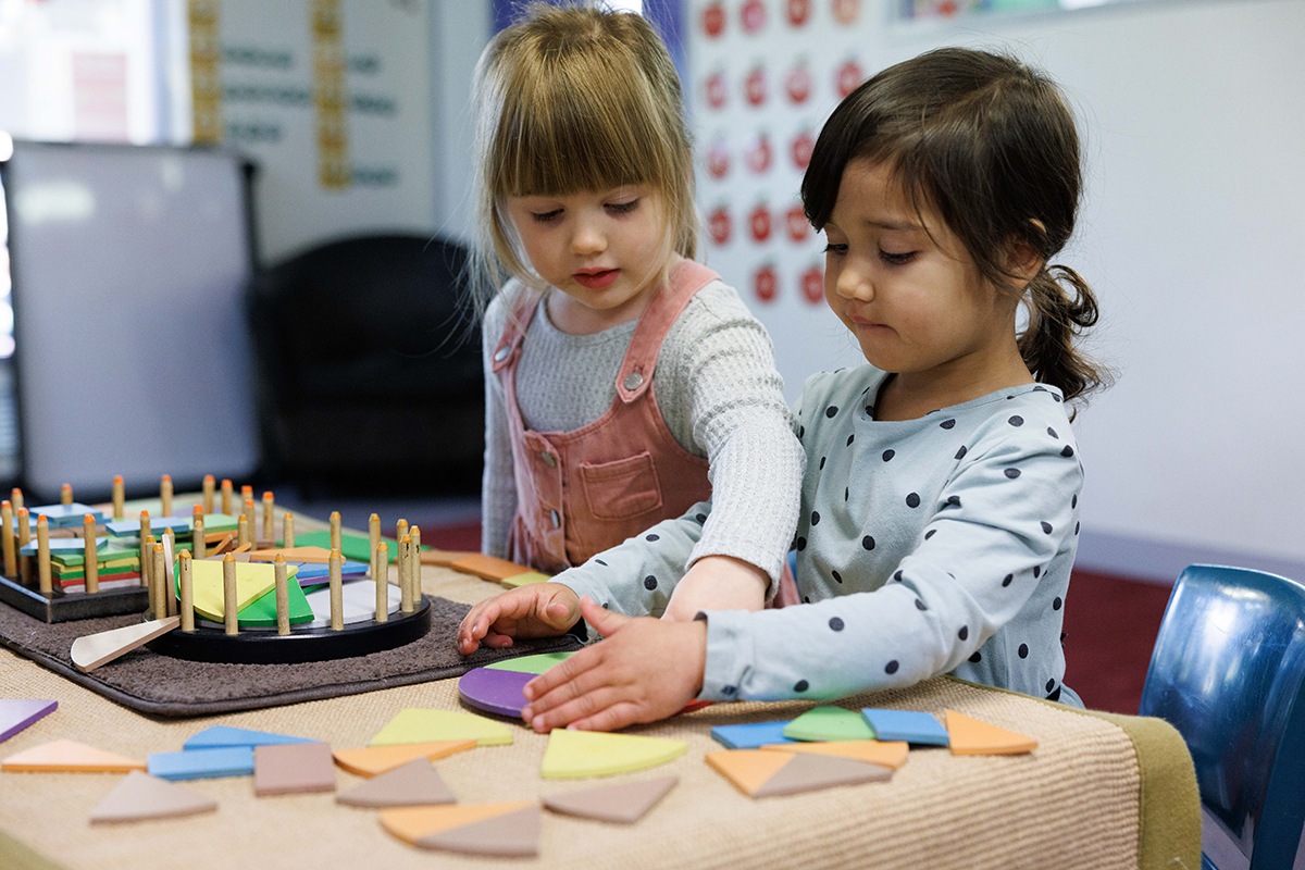 two toddler girls at childcare